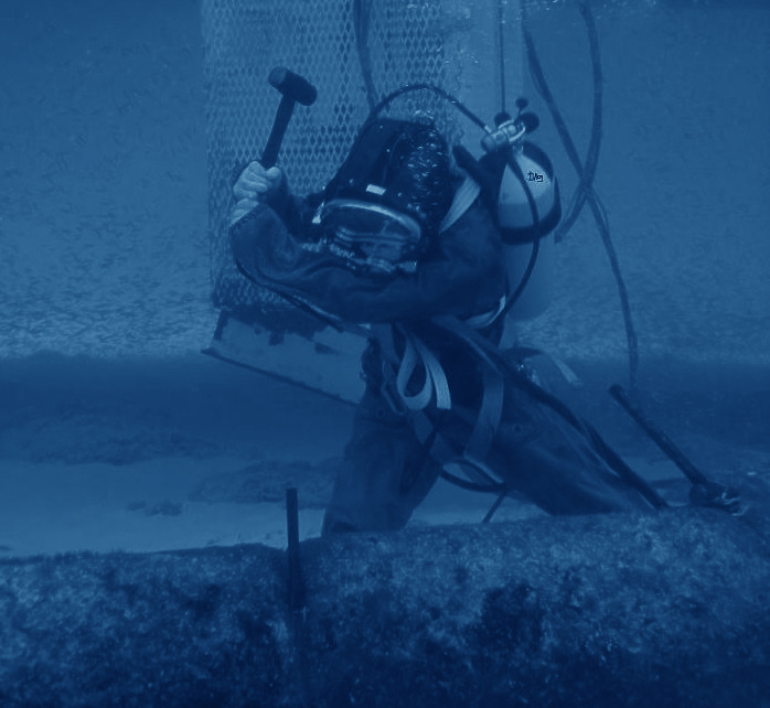 diver holding a hammer